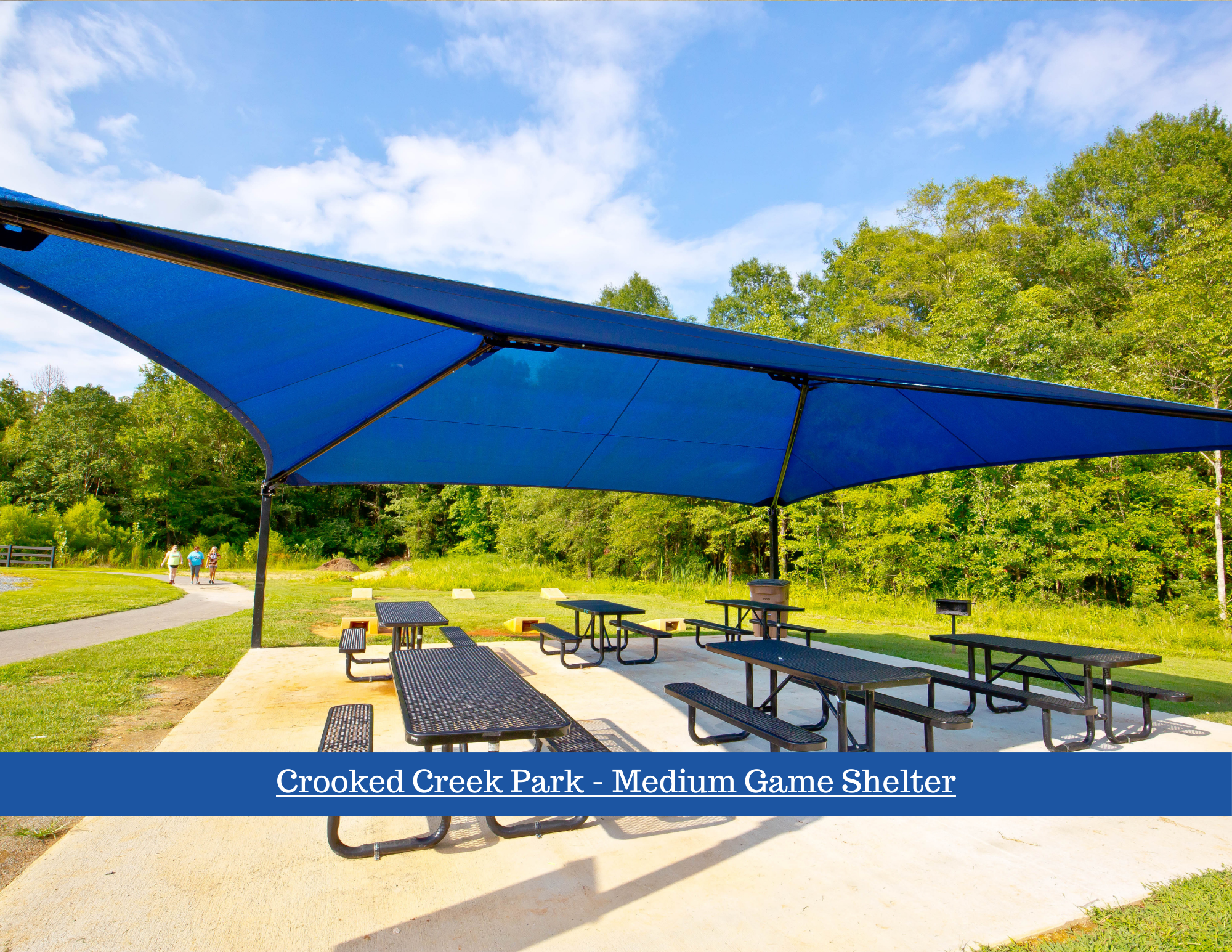 Medium sized covered shelter with picnic tables, ping pong table, and cornhole boards